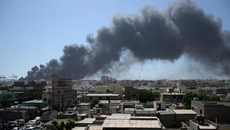 Smoke billows after a drone strike at Port Sudan on May 6, 2025.