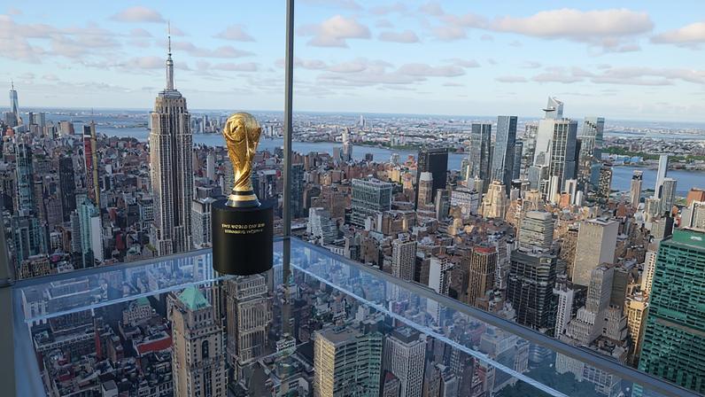 A FIFA World Cup trophy is displayed above the New York skyline on July 1, 2024, during a trophy tour of tournament host cities.