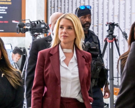 The former Attorney General Pam Bondi, center, arrives for her deposition on Capitol Hill.