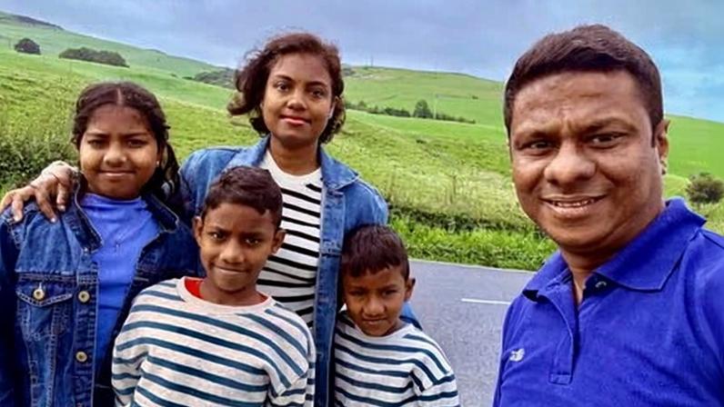 Rasika Samarasinghe, a care worker who arrived in 2022, with his wife and children – who have now been told they must leave.