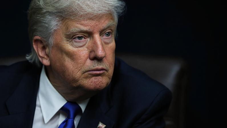 FILE PHOTO: U.S. President Donald Trump looks on as he signs executive orders and proclamations in the Oval Office at the White House, in Washington, D.C., U.S., May 5, 2025. REUTERS/Leah Millis/File Photo