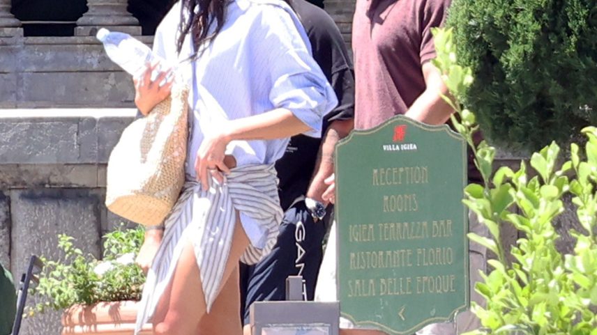 Locals in Sicily, Italy, are protesting Dua Lipa and Callum Turner’s three-day wedding by plastering posters and tagging graffiti all over the town squares (the couple pictured above in Palermo ahead of their nuptials).