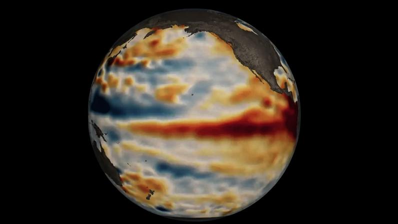 Globo terrestre mostrando o Oceano Pacífico com áreas em vermelho indicando águas mais quentes e em azul, águas mais frias, representando o fenômeno El Niño