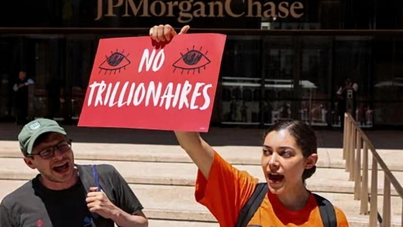 People protest against the SpaceX IPO in New York.