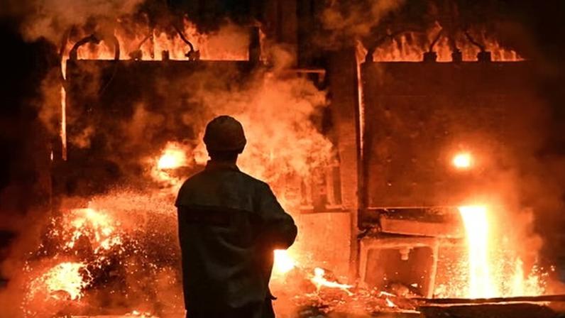 An employee works at Zaporizhstal iron and steel works in Ukraine, partly owned by Metinvest.