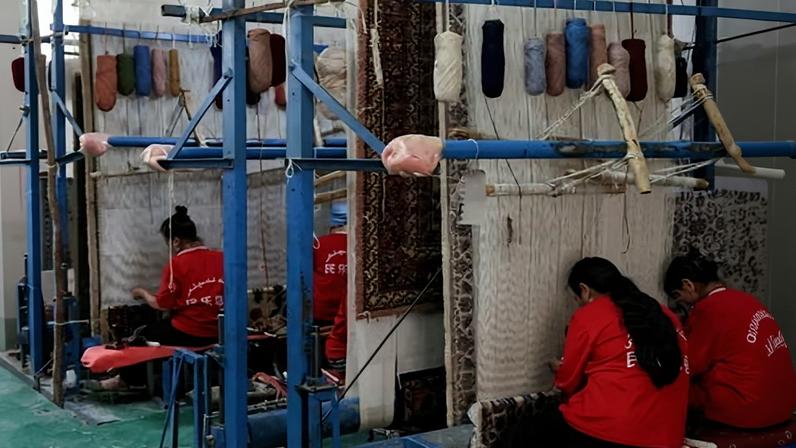 A general view of Minle handmade wool carpet factory on 28 May 2024 in Luopu County of Hotan, Xinjiang Uyghur Autonomous Regio, China.