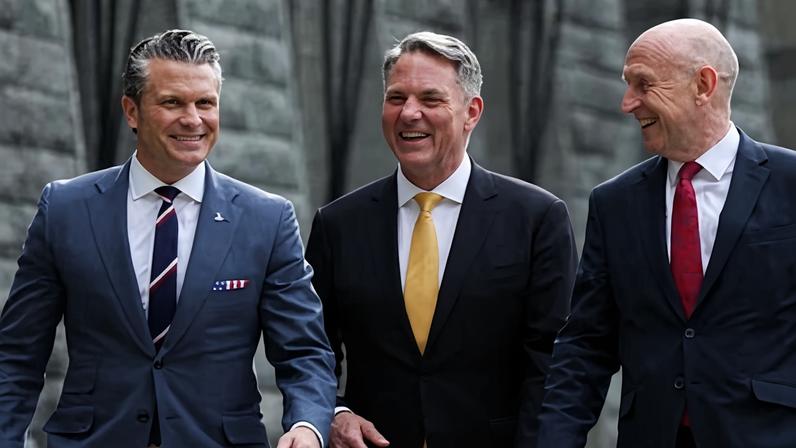 Australian defence minister Richard Marles, centre, flanked by US and UK counterparts Pete Hegseth (L) and John Healey.