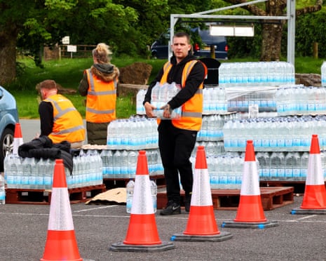 South West Water handing out emergency rations of bottled water to anyone affected by the parasite outbreak in Brixham, Devon.