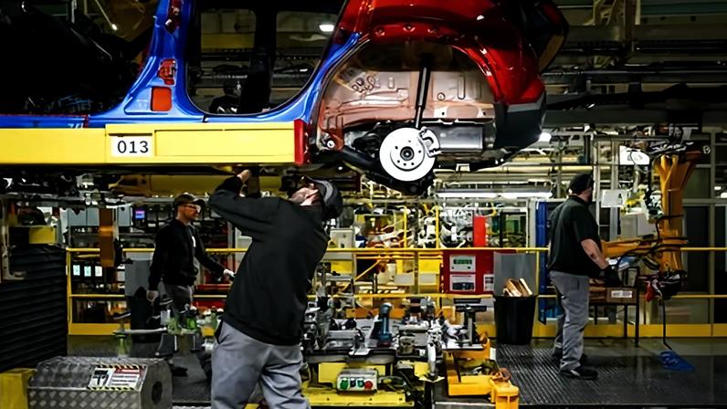 A Nissan employee works on the Sunderland assembly line.