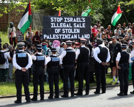 People from pro-Palestinian activist groups gather outside the Edgware United synagogue in London.