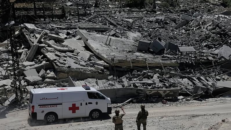 Lebanese soldiers in front of destroyed houses in the village of Dibbin, southern Lebanon. Israeli forces withdrew from the village on Thursday.