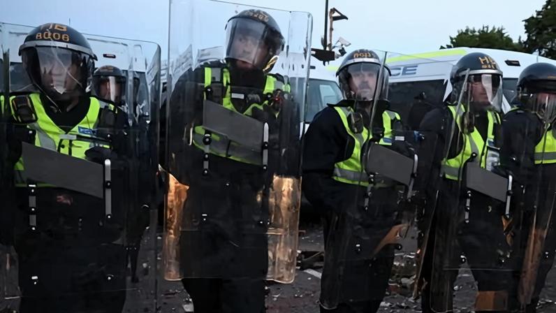 Riot police line up during a protest attended by far-right figures in Southampton on Tuesday.