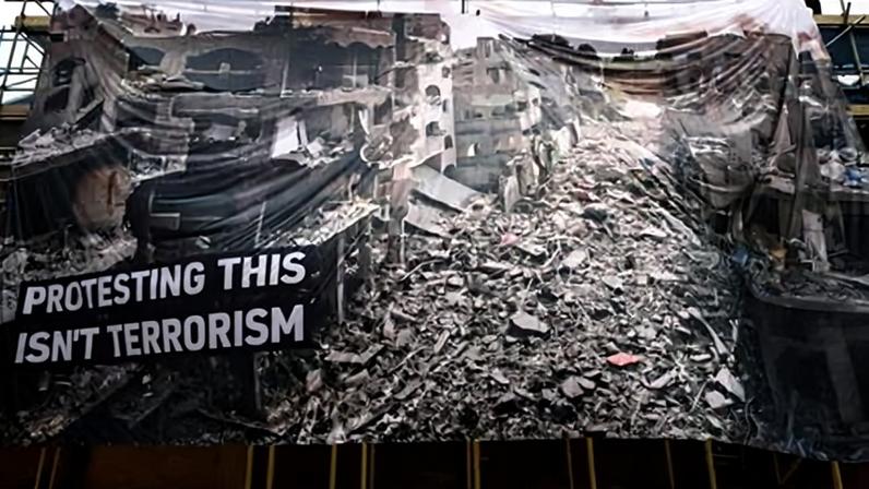A protest banner erected in support of the four Palestine Action protesters found guilty of criminal damage at an Israeli arms site last month.