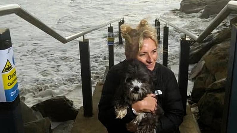 Sarah Darbyshire with her dog Mr Bean at Glenelg North beach in South Australia.