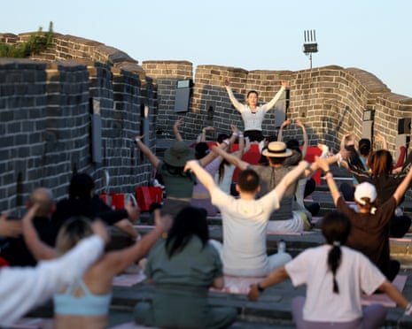 Athleisure brand Lululemon join a tai chi-yoga session at the Huanghuacheng Lakeside Great Wall.