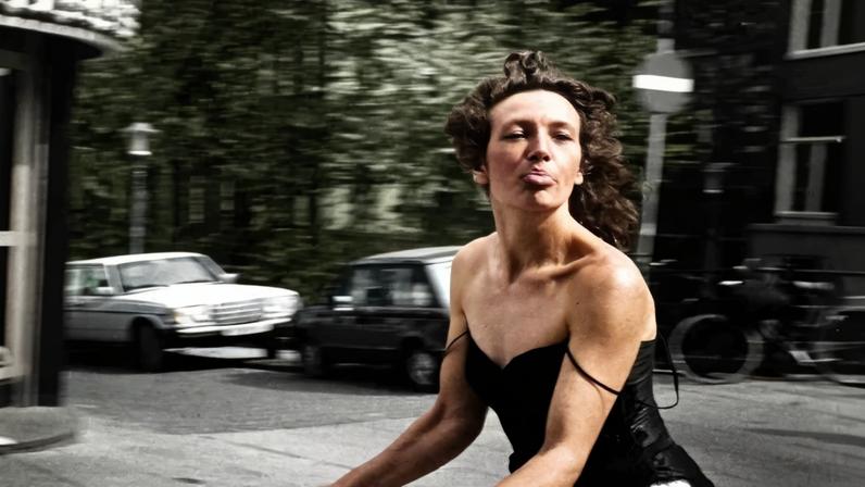 Woman on a Bicycle (1983), taken in Amsterdam by the Dutch photographer Ed van der Elsken