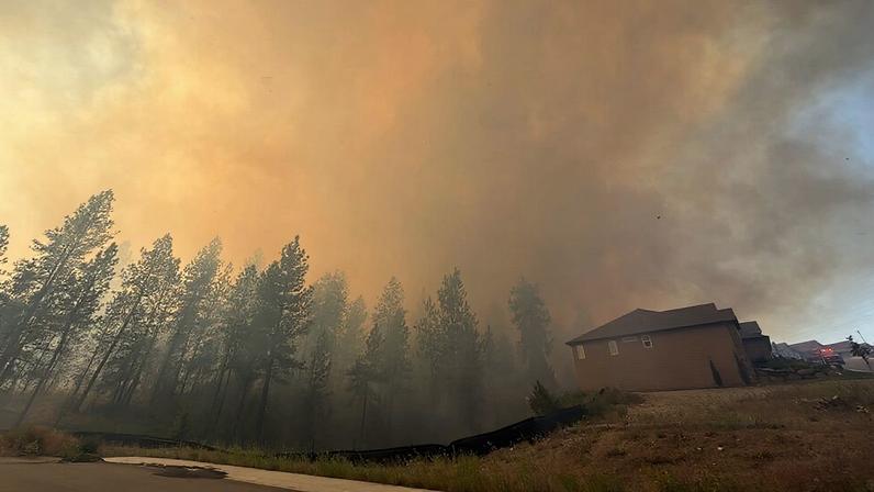 This photo provided by Spokane Fire District 9 shows the Upriver Fire burning northeast of Spokane, Wash., on Tuesday, June 16, 2026. (Robert Gray/Spokane Fire District 9 via Associated Press.