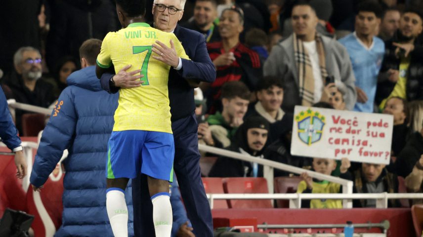 Carlo Ancelotti, head coach of Brazil's national men's soccer team, hugs midfielder Vinícius Júnior during a match in London on Nov. 15, 2025.