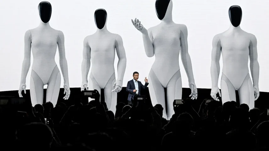 A man in a suit stands at a podium alongside four towering humanoid robots.