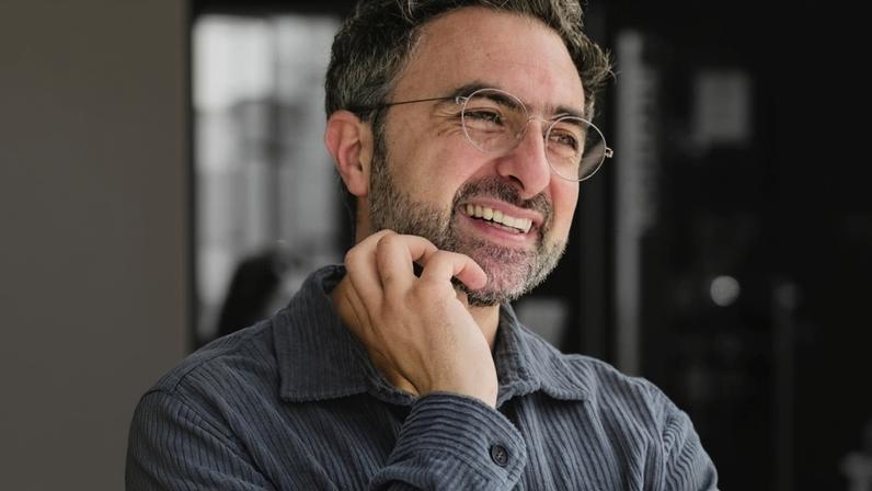 A photo illustration of Microsoft AI CEO Mustafa Suleyman.