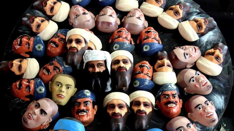 A worker gives the final touches to carnival masks on February 15, 2007 in Rio de Janeiro, Brazil.