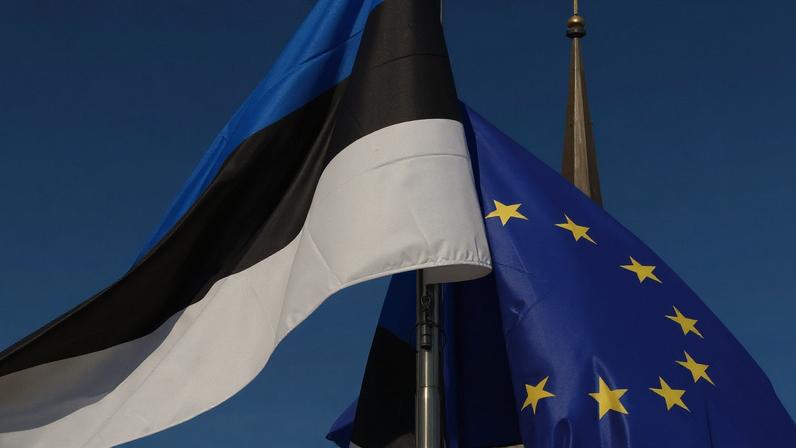 The Estonian and the European flag are pictured during the opening concert at the Freedom Square in Tallinn to celebrate Estonia's six month EU Presidency on June 29, 2017.