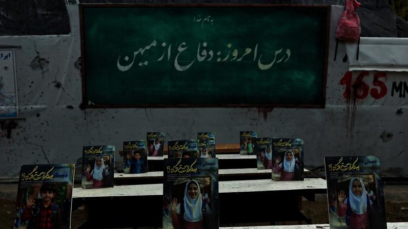 A memorial depicting the children killed at Minab is displayed in a square in Tehran on May 3.