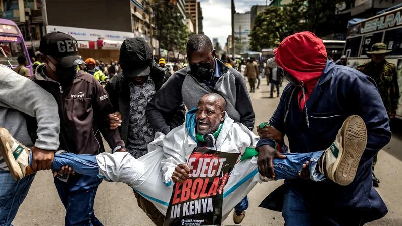 Plainclothes Kenyan police officers arrest an activist in downtown Nairobi on June 2, during a protest against a U.S.-built Ebola quarantine center planned at Kenya’s Laikipia Air Base.