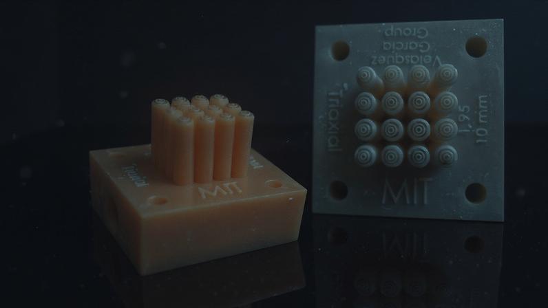 MIT researchers have demonstrated a low-cost design of specialized electronic nozzles, called triaxial electrospray emitters (pictured here), that could be used to manufacture time-release drug-delivery particles or self-healing materials.