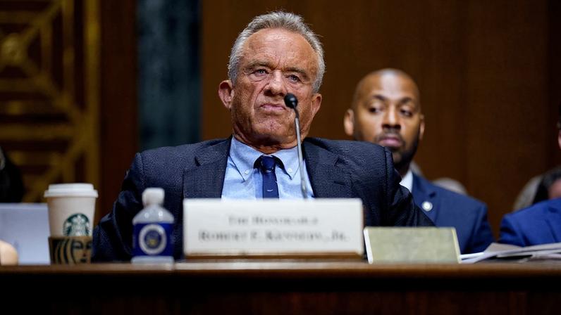 U.S. Health and Human Services Secretary Robert F. Kennedy Jr. sits back in his chair with pursed lips during a Senate hearing that he is testifying at on Capitol Hill.