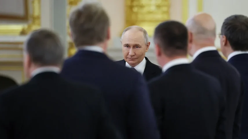 Russian President Vladimir Putin walks during a meeting with his Tanzanian counterpart at the Kremlin in Moscow.
