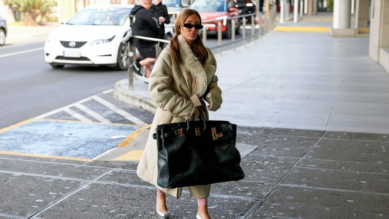Bianca Censori was spotted at the Melbourne airport carrying an oversized Hermès Birkin bag.