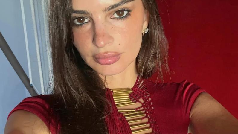 Emily Ratajkowski celebrated her 35th birthday in a revealing red cutout dress.