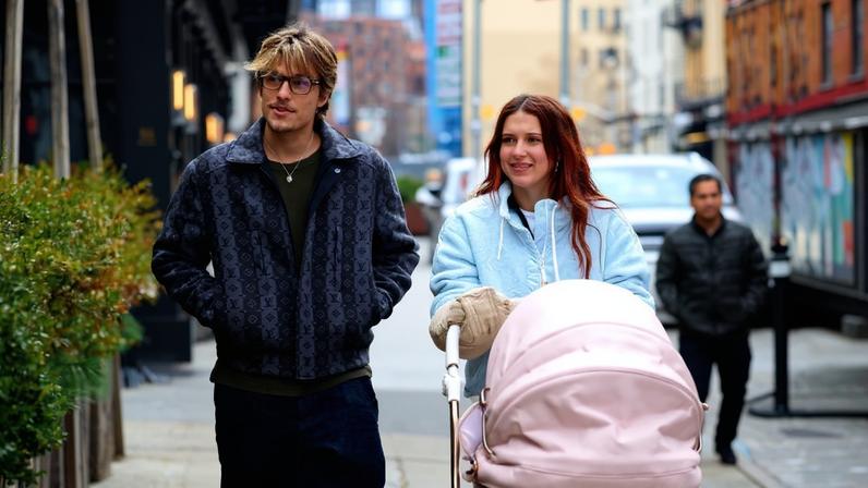 Millie Bobby Brown defended her “sweet” husband, Jake Bongiovi (pictured last December), after he was criticized for not carrying her bags or pushing their baby's stroller.