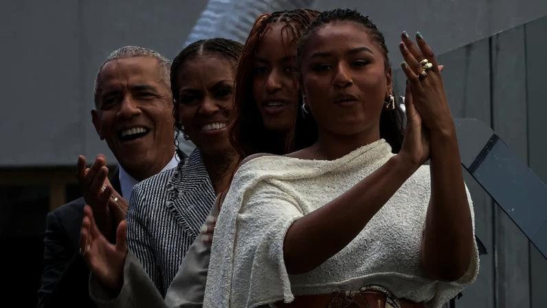 Malia and Sasha Obama made a rare public appearance at the grand opening of the Obama Presidential Center in Chicago on Thursday.