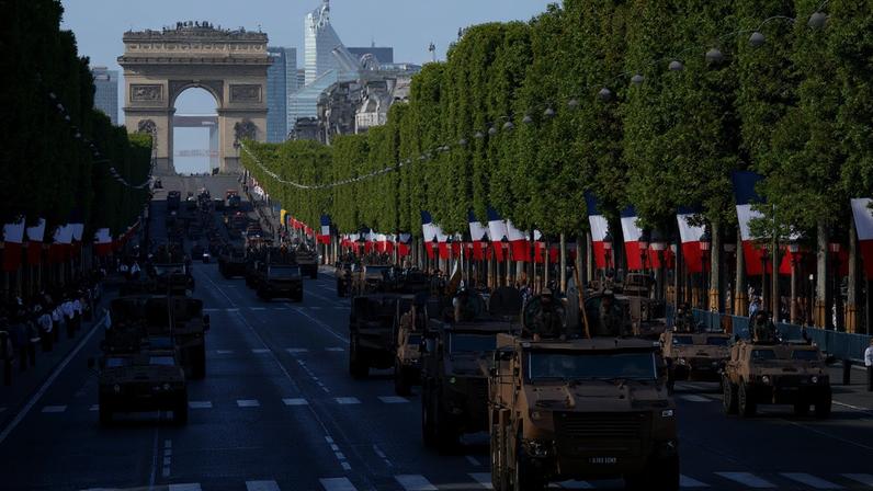 French soldiers drive Griffon armored vehicles during the Bastille Day military parade on Champs-Elysees avenue in Paris on July 14, 2022.