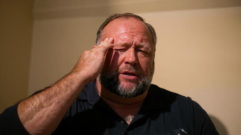 InfoWars founder Alex Jones speaks to the media outside Waterbury Superior Court during his trial on September 21, 2022.