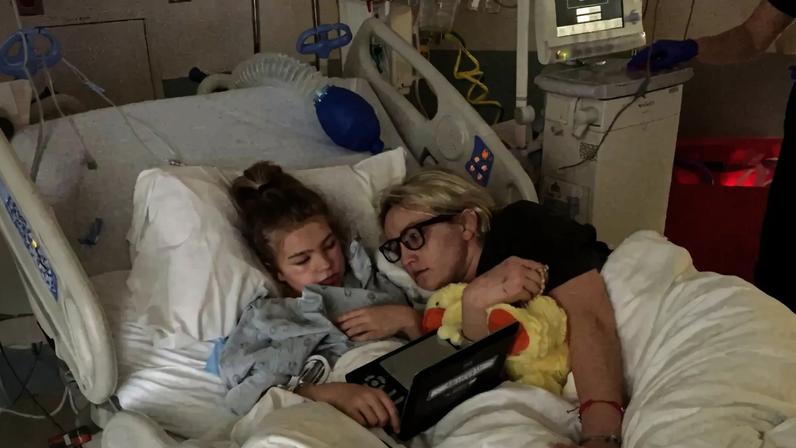 Jamie Lynn Spears and her daughter Maddie in a hospital bed.