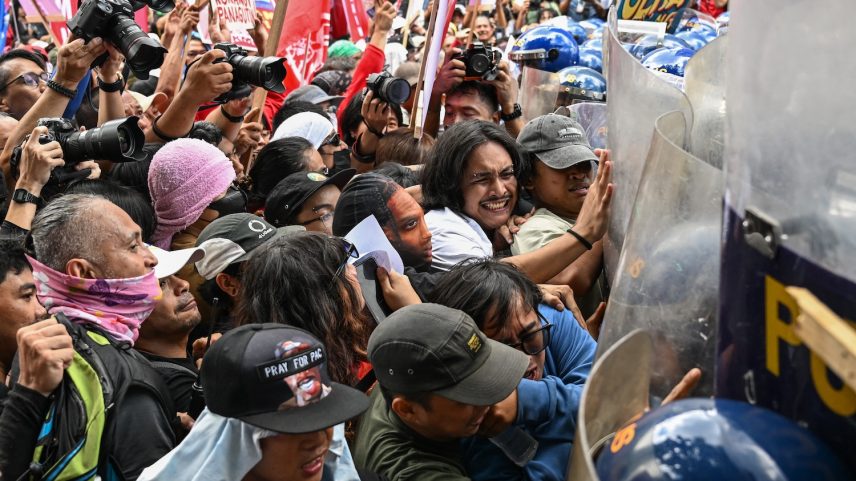 Protesters clash with police during a demonstration to mark International Labour Day in Manila on May 1.