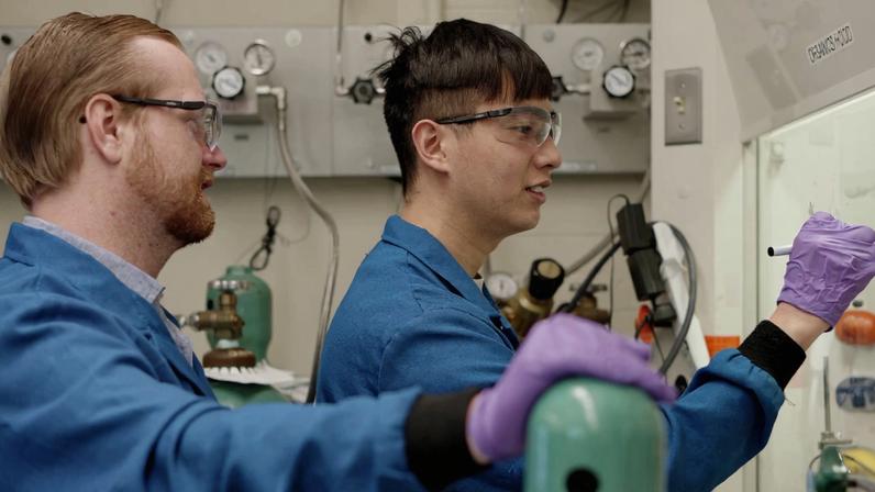 Glen Junor (left) and Fang-Yu Kuo work in the lab.