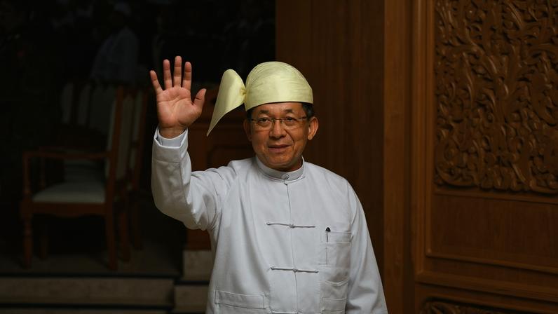 Myanmar President Min Aung Hlaing waves as he leaves after his swearing-in ceremony in Naypyidaw, Myanmar, on April 10.