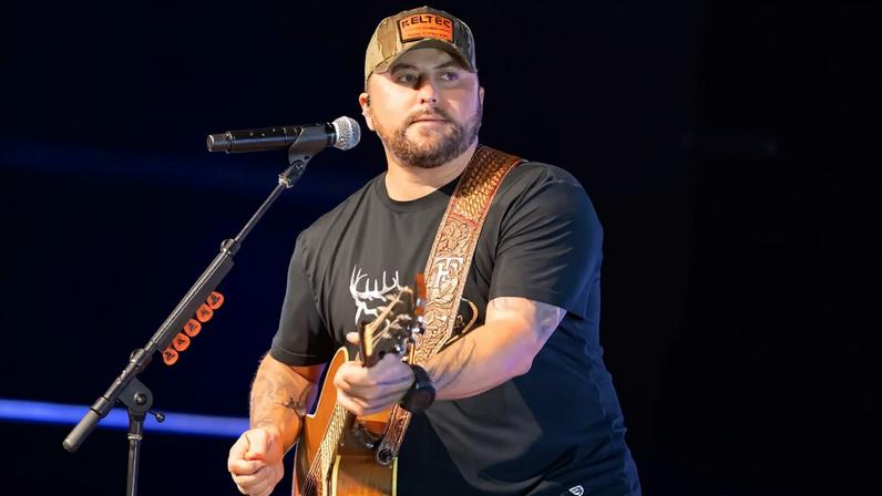 Country singer Tyler Farr (pictured here in April) was forced to cancel his performance after sustaining a “severe concussion” in a farming accident.
