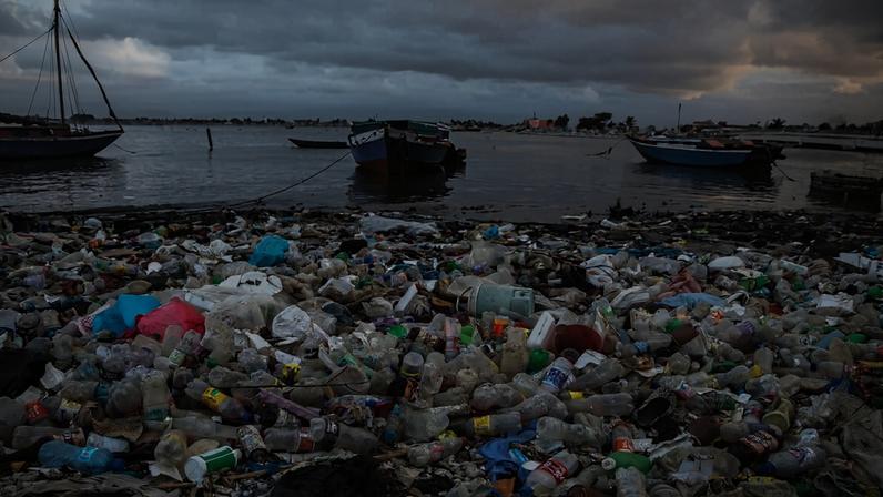 Plastic bottles and debris blanket the shoreline in Cap-Haitien, Haiti, on March 10, 2022. Image by AP Photo/Odelyn Joseph.