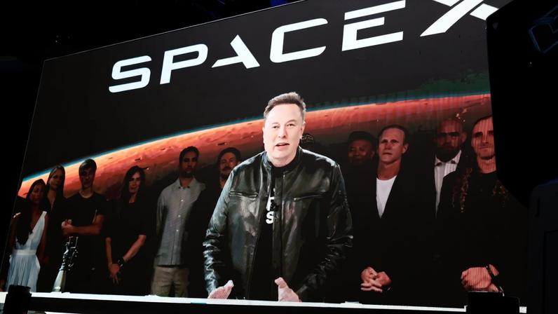 SpaceX CEO Elon Musk speaks via video at the launch of the company's initial public offering at Nasdaq MarketSite on Times Square in New York, on June 12.