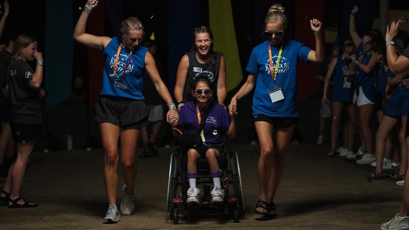 Volunteers welcome campers at Camp Barnaba