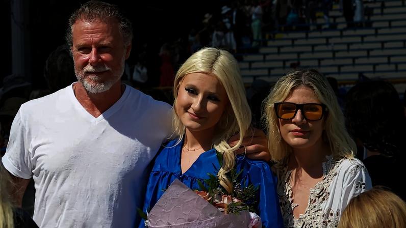 Tori Spelling and ex-husband Dean McDermott reunited for their daughter Stella’s high school graduation, as seen above.