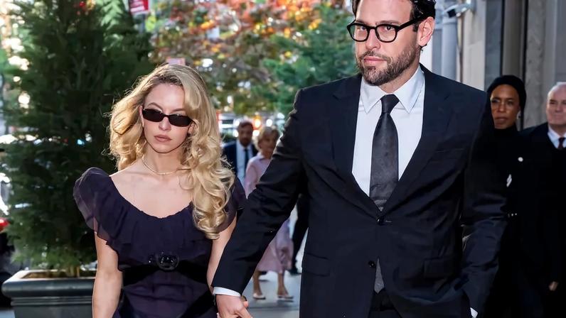 Sydney Sweeney and Scooter Braun walk hand-in-hand in New York City.