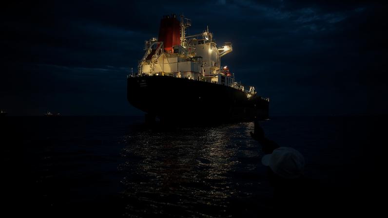 A ship remains anchored in the Strait of Hormuz near Larak Island, Iran, on May 16.