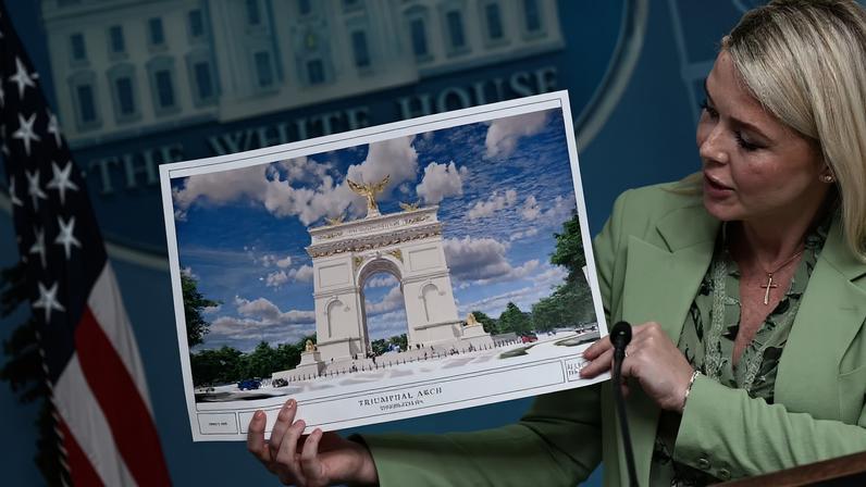 White House press secretary Karoline Leavitt shows an artist's rendering of U.S. President Donald Trump's planned "Triumphal Arch" during a press briefing at the White House in Washington on April 15.